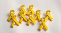 top yellow ribbon pins